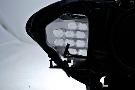 HELLA Headlight Assembly - 010131651