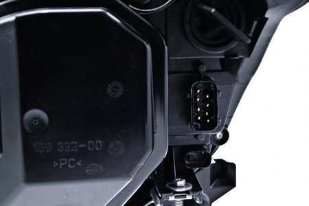 HELLA Headlight Assembly - 160292011